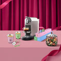 Nespresso Citiz Swarovski Edition promotional banner with machine and gift set including cups and storage jar