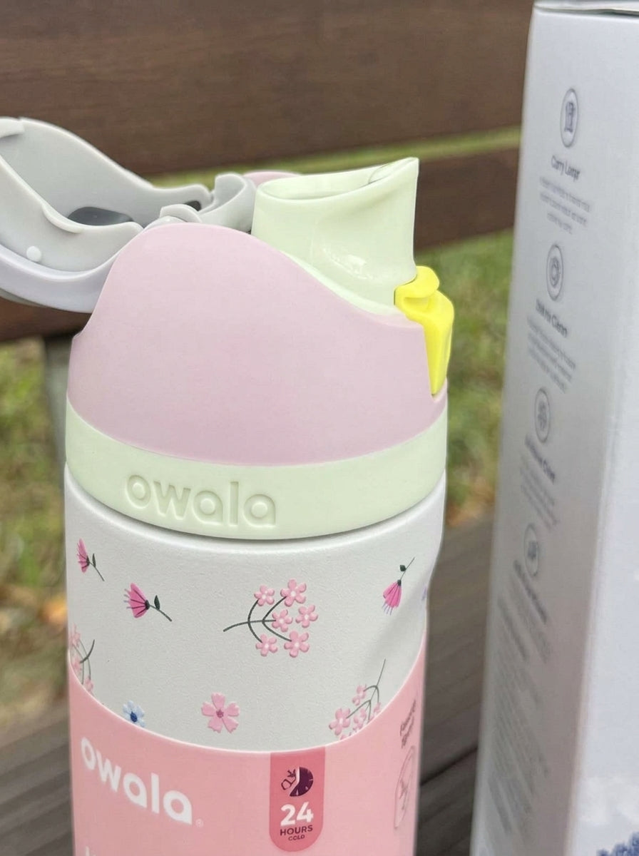Owala pink floral insulated bottle with carry loop and straw spout