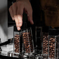 MUVNA airtight single dose coffee bean storage tubes with clear acrylic design and wood base