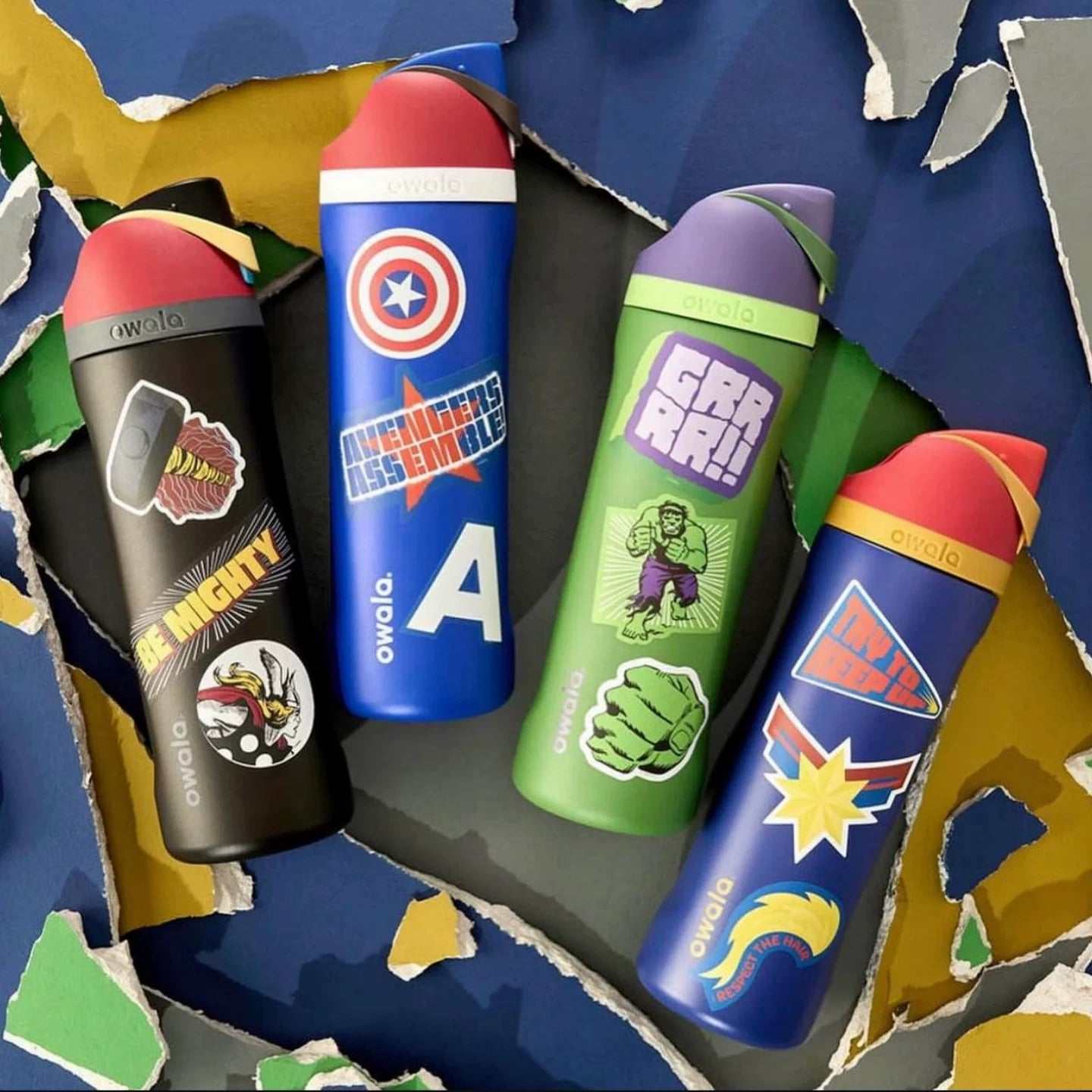 Owala 24oz FreeSip Marvel water bottles featuring Spider-Man, Iron Man, Thor, and Captain America designs with matching stickers