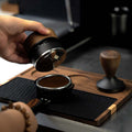 Solid wood espresso tamping station with silicone mat and tool slots