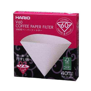 Hario V60 coffee paper filters for pour over dripper in white and natural wood variants