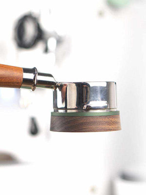 Magnetic espresso dosing funnel with walnut wood finish on portafilter