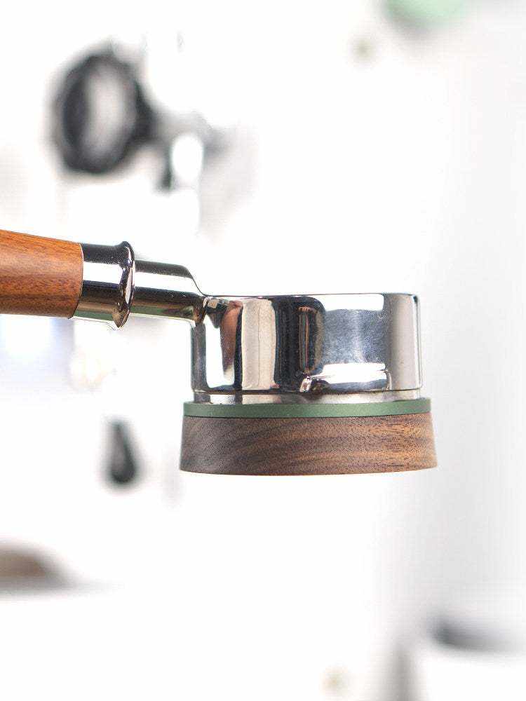 Magnetic espresso dosing funnel with walnut wood finish on portafilter