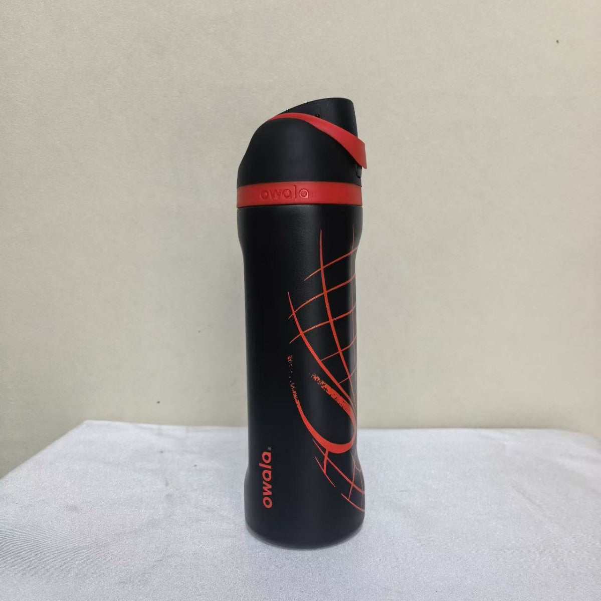 Owala FreeSip Spider-Man insulated water bottle with covered spout and carry loop for everyday use
