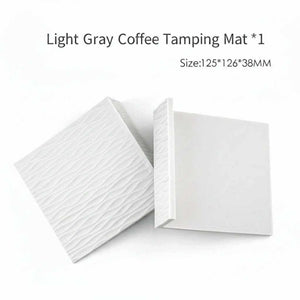 Silicone non-slip corner espresso tamping mat on countertop edge