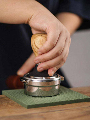 silicone non-slip corner espresso tamping mat on countertop edge