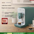 SMEG BCC02 automatic espresso machine with steam wand on countertop