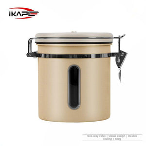 IKAPE Stainless Steel airtight coffee canister with date tracker and scoop on kitchen counter