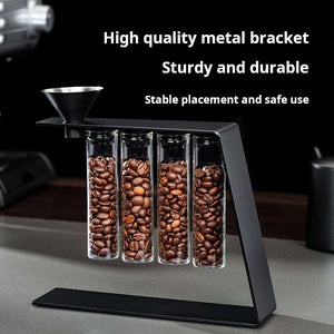 Magnetic coffee bean storage tubes with glass containers on metal stand and stainless steel funnel for fresh single-dose espresso beans